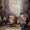 Load image into Gallery viewer, Signed Storm-Worn Sailing Ship Miniature with Distressed Sails