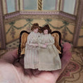 Load image into Gallery viewer, Maureen Thomas Two Girls on Children's Victorian Settee 1:12 Miniature Vignette