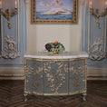 Load image into Gallery viewer, Decorative miniature dollhouse bowl of fruit on a cabinet with marble top and gold embellishments in an ornate room.
