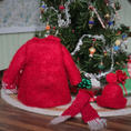 Load image into Gallery viewer, Dollhouse miniature back of wool coatand accessories in front of a decorated Christmas tree.
