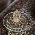 Load image into Gallery viewer, Gold-colored Buddha statue on a decorative stand with intricate patterns