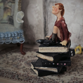 Load image into Gallery viewer, 1:24 Scale Older Beggar Woman Clay Figure OOAK Handmade Miniature on Stack of Books