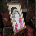Load image into Gallery viewer, Framed artwork of a traditional Japanese geisha on an easel with a blurred indoor background Alexandra R.