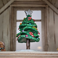 Load image into Gallery viewer, Decorative Christmas tree figurine with candy decorations on a wooden surface.