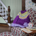 Load image into Gallery viewer, Purple Dollhouse miniature sweater on a patterned chair with a staircase in the background