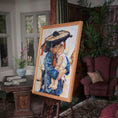 Load image into Gallery viewer, Painting of a woman holding a child on an easel in a room with furniture and plants. Deanna Karras