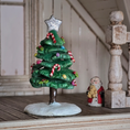 Load image into Gallery viewer, Decorative Christmas tree figurine with candy canes and a star on top, placed on a wooden surface.