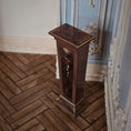 Load image into Gallery viewer, Wooden pedestal on a wooden floor with decorative elements in the background