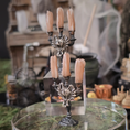 Load image into Gallery viewer, Decorative candelabrum with candles on a table in a rustic setting