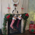 Load image into Gallery viewer, Decorative Christmas mantel with stockings, garlands, and a clock.