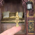 Load image into Gallery viewer, Gold Buddha statue held in front of a decorative background