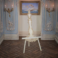 Load image into Gallery viewer, Decorative carved miniature easel in an ornate room with wall sconces and a painting.