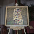 Load image into Gallery viewer, Framed painted art of 'The Kiss' by Gustav Klimt on an easel by Sam Kelm