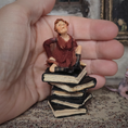 Load image into Gallery viewer, 1:24 Scale Older Beggar Woman Clay Figure OOAK Handmade Miniature on Stack of Books