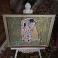 Load image into Gallery viewer, Framed artwork resembling 'The Kiss' by Gustav Klimt on a stand.