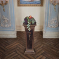 Load image into Gallery viewer, Decorative pedestal with fruits and vegetables in an ornate room.