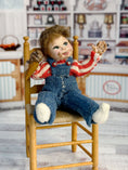 Load image into Gallery viewer, Messy Little Boy Doll with Overalls & Ice Cream Cone, sitting in chair