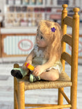 Load image into Gallery viewer, Sculpted Blonde Seated Young Girl Toddler Doll w Lollipop, left side
