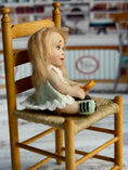 Load image into Gallery viewer, Sculpted Blonde Seated Young Girl Toddler Doll w Lollipop, right side