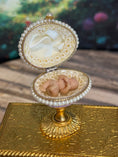 Load image into Gallery viewer, Artisan Signed, 'Hiller' sculpted vintage miniature baby in glittered footed pink egg stand, open view