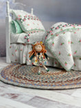 Load image into Gallery viewer, Ann Anderson Toy Dolly in Floral Spring Dress, standing in front of a child's bed