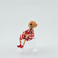 Load image into Gallery viewer, Yawning elf doll in red and white striped pajamas sitting against a white background