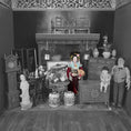 Load image into Gallery viewer, Vintage dollhouse scene with furniture and dolls arranged in a room setting.