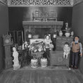 Load image into Gallery viewer, Black and white miniature room setup with furniture and decorative items.