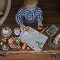 Load image into Gallery viewer, Miniature doll in a checkered shirt with a letter and cookies on a wooden table
