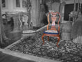 Load image into Gallery viewer, Two wooden chairs with embroidered seats on a patterned rug in a room with furniture and decor.