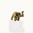 Load image into Gallery viewer, Bronze elephant figurine on a white pedestal with a white background