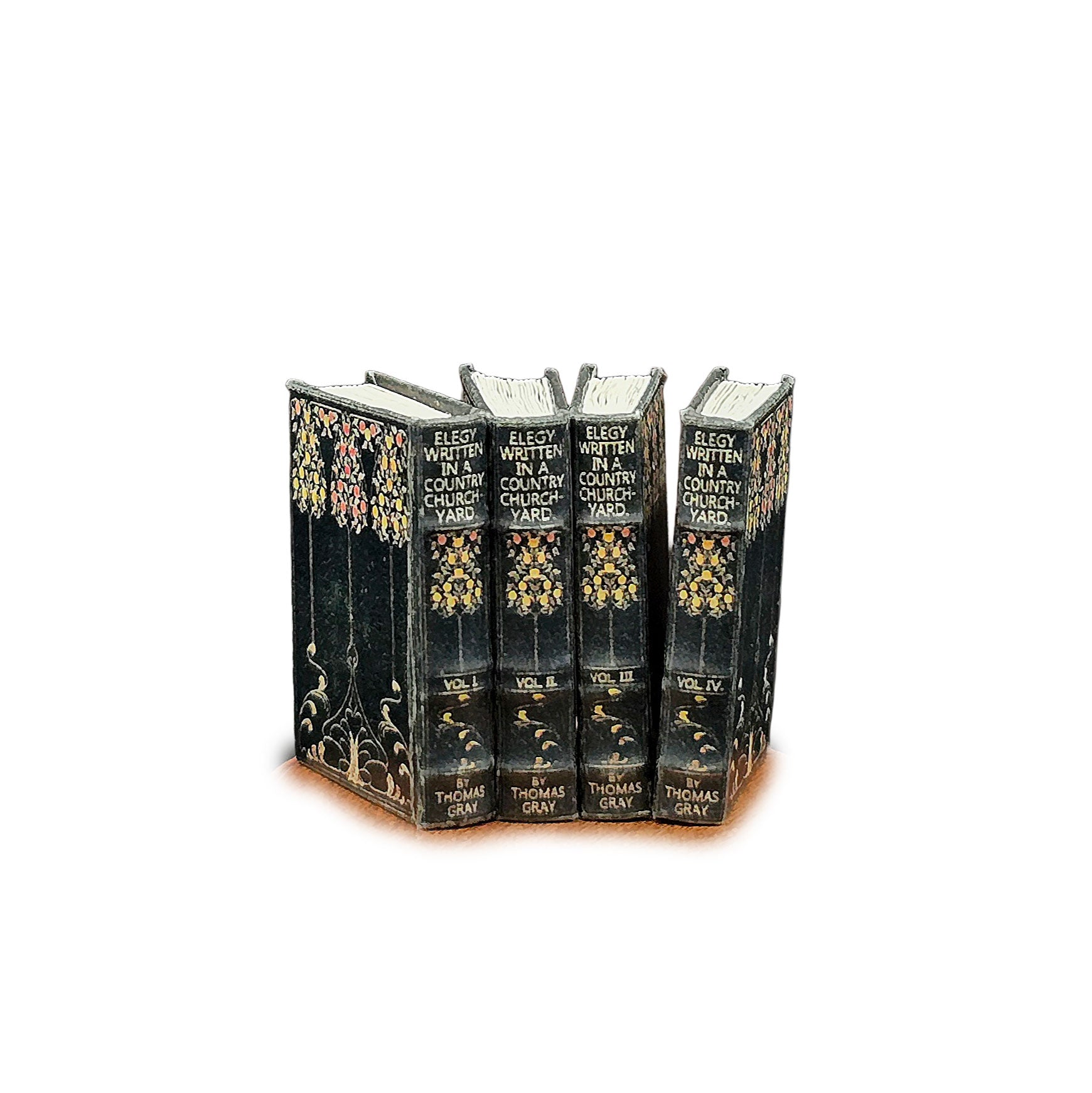 Set of four ornate books with decorative covers on a white background