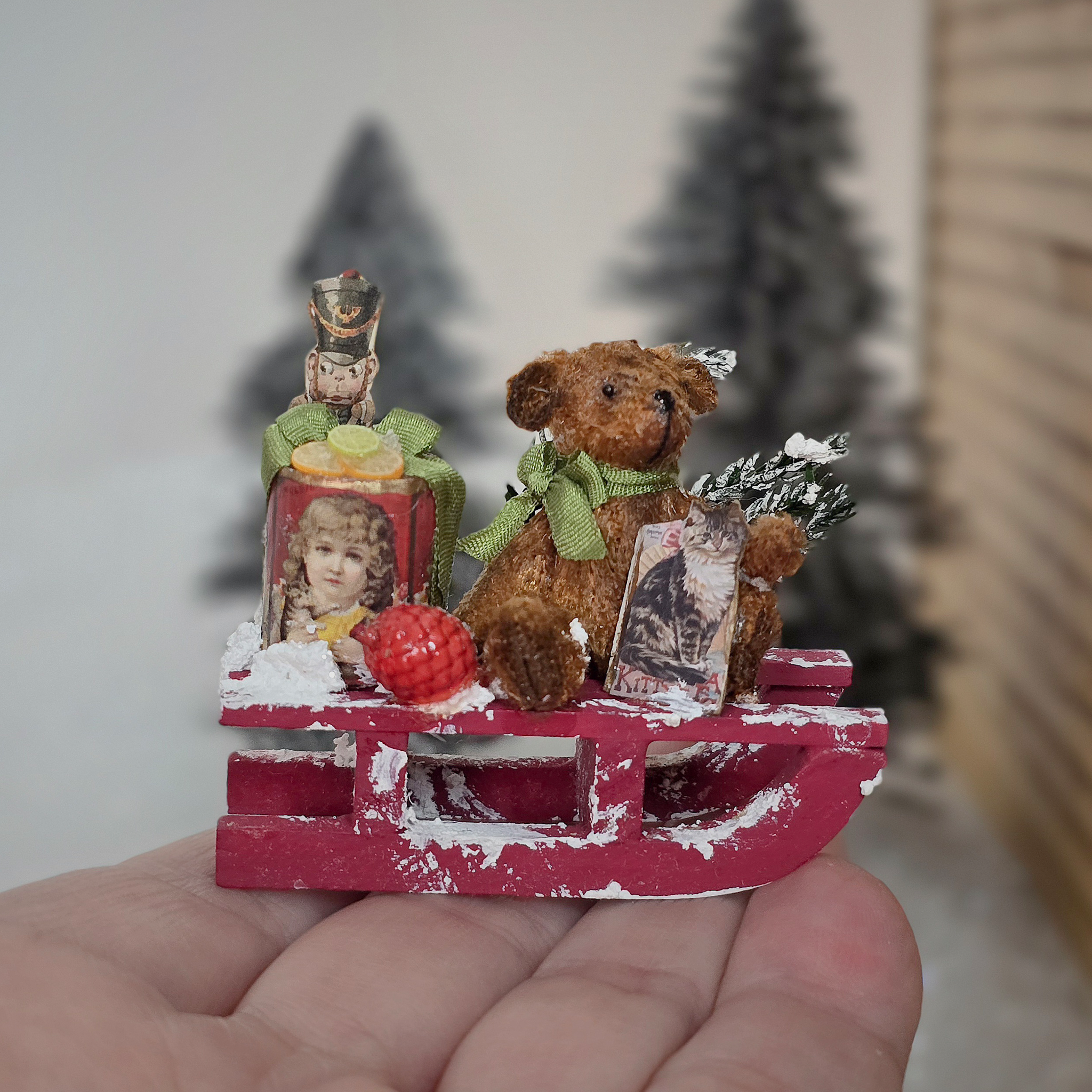 Miniature Snowy Christmas Vignette – Le Coffre D’Emilie on a hand, close-up