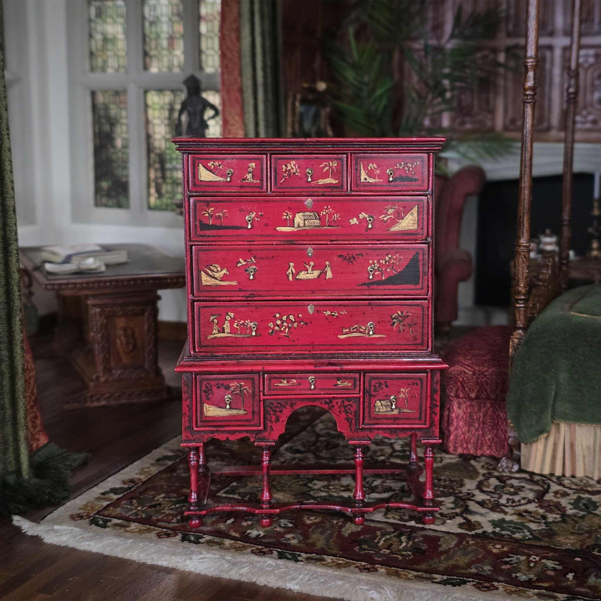 Red wooden dresser with intricate carvings in a vintage room setting. Alan Barnes