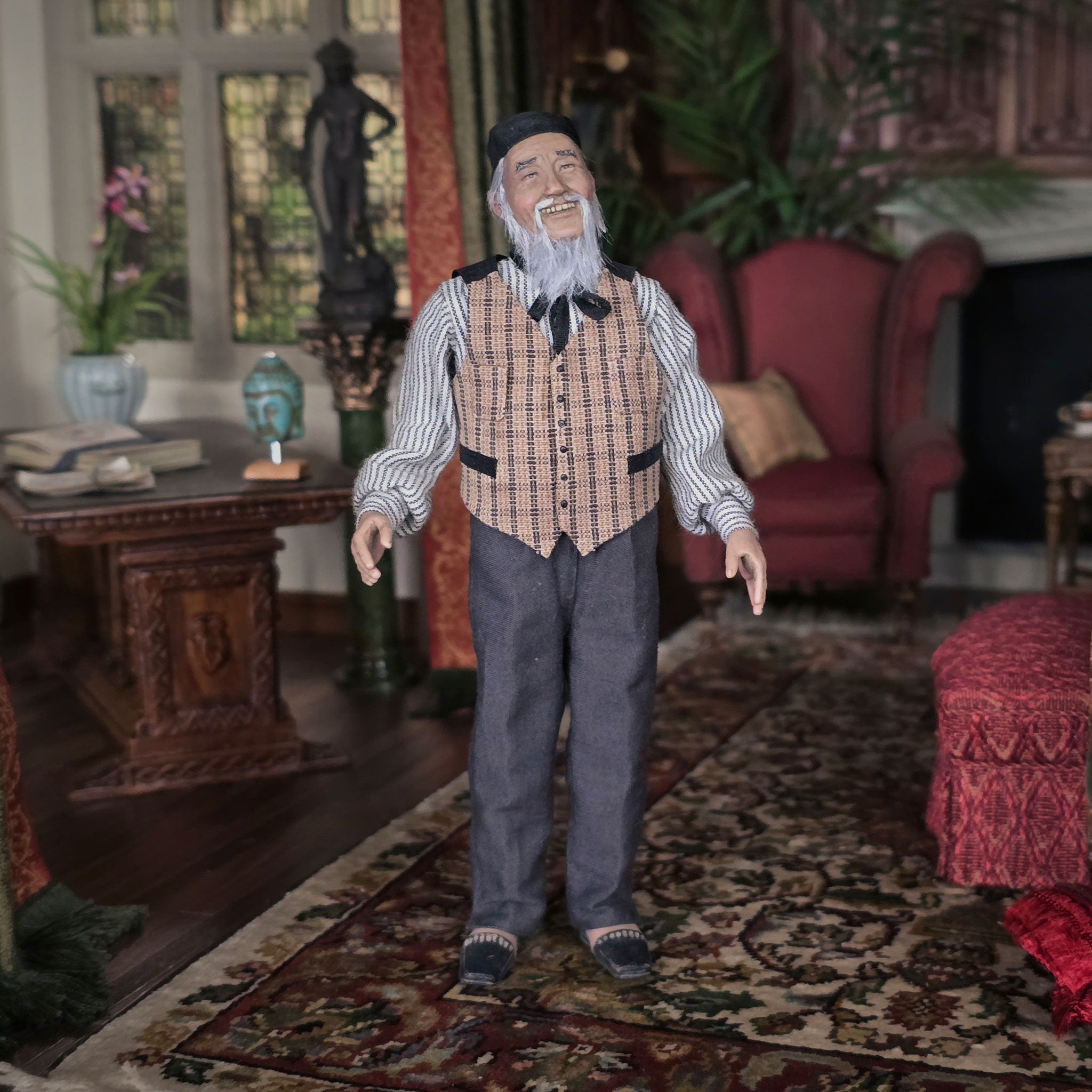 Vintage-style clay dollhouse doll in a living room setting with furniture and decor.