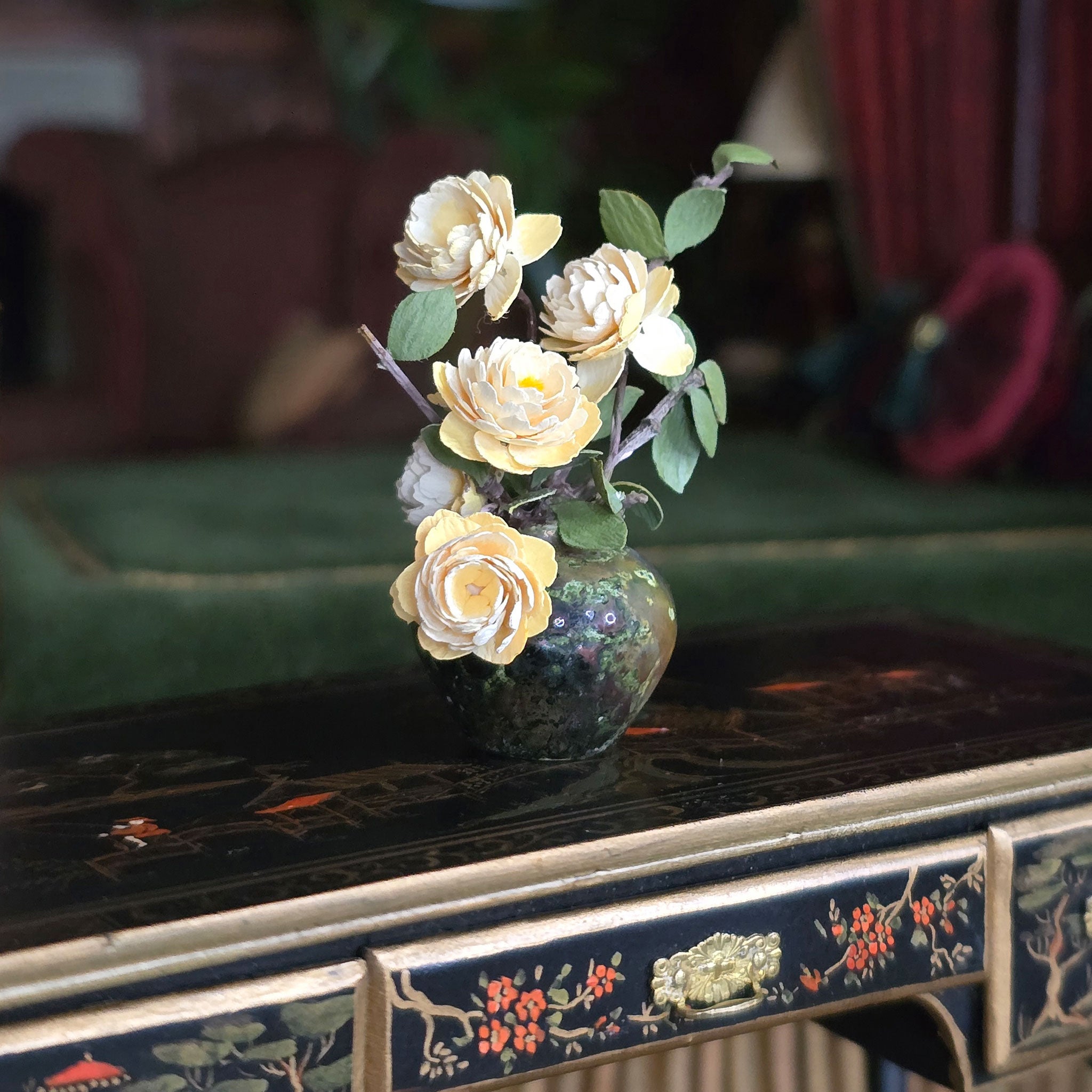 Decorative vase with flowers on a ornate table