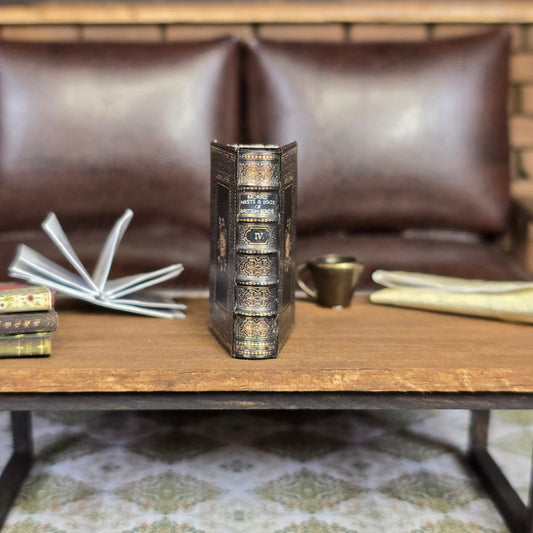 Decorative book on a wooden table in a living room setting.