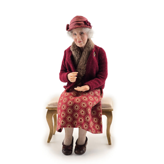 Julie Campbell IGMA Seated Elder Lady Doll in Burgundy Coat Clay Character Figure