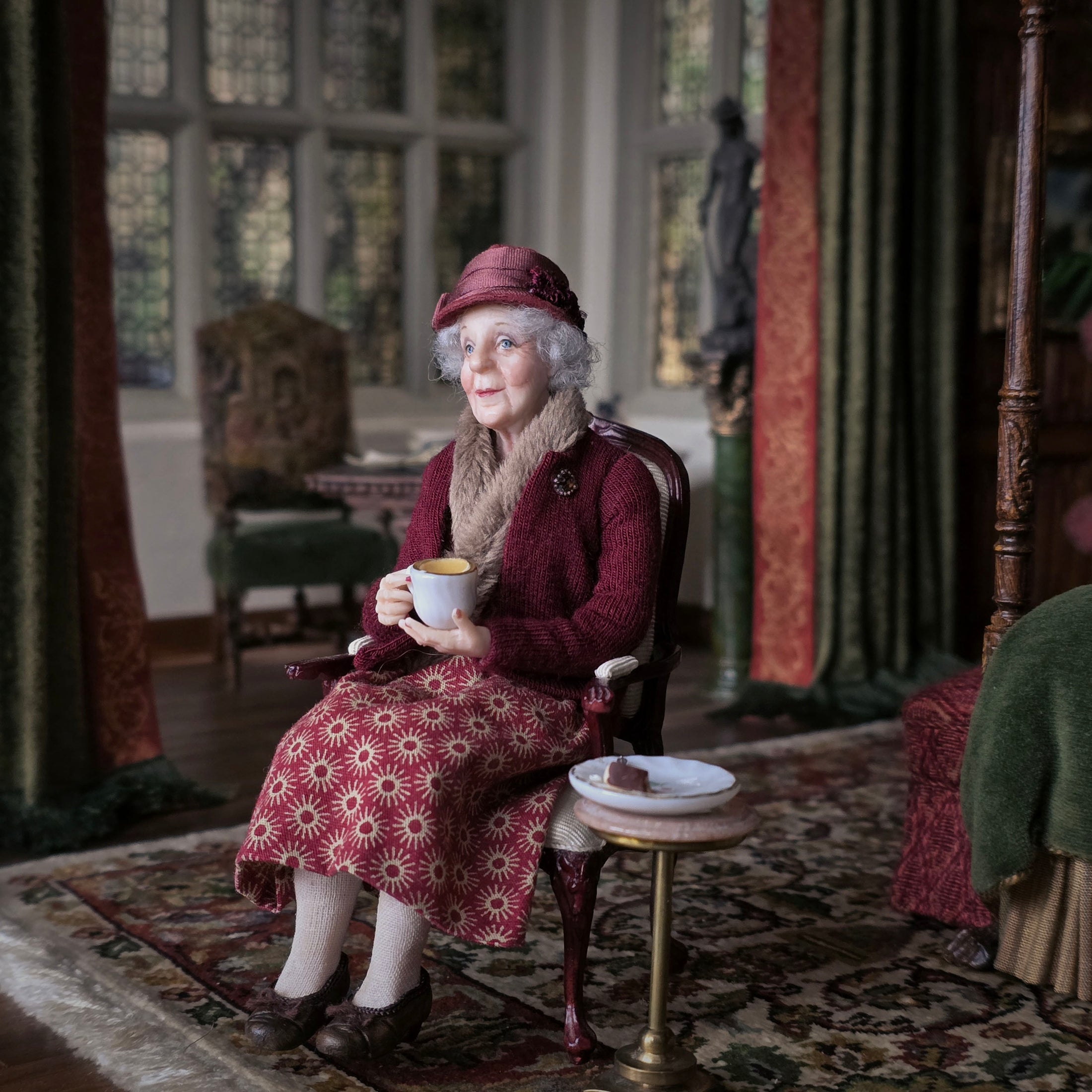 Julie Campbell IGMA Seated Elder Lady Doll in Burgundy Coat Clay Character Figure