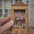 Load image into Gallery viewer, Spanish Curio Cabinet Diorama with Dolls and Toys Dollhouse Miniature
