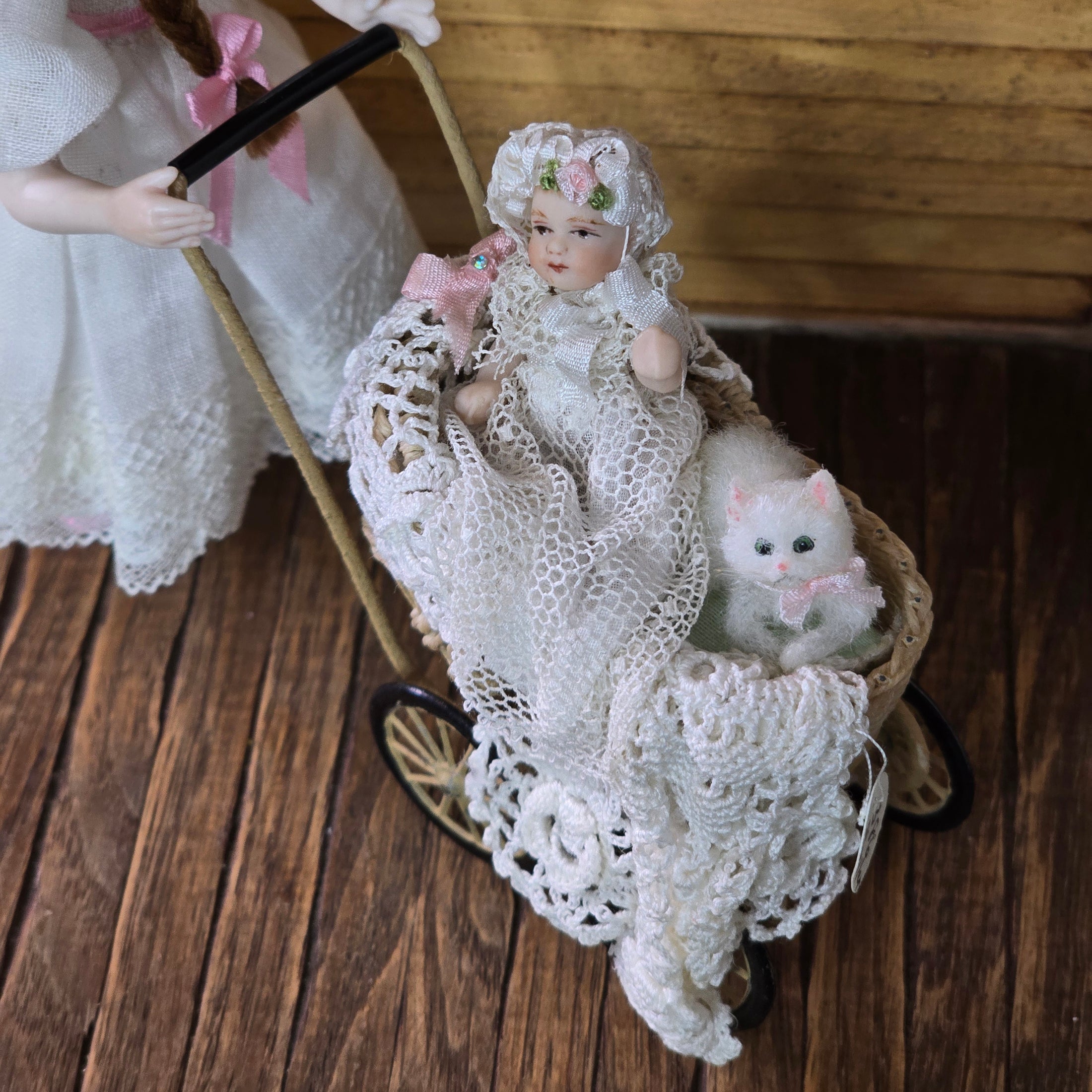 Signed Wicker Baby Pram with Porcelain Infant Doll and Cat by Bridget McCarty