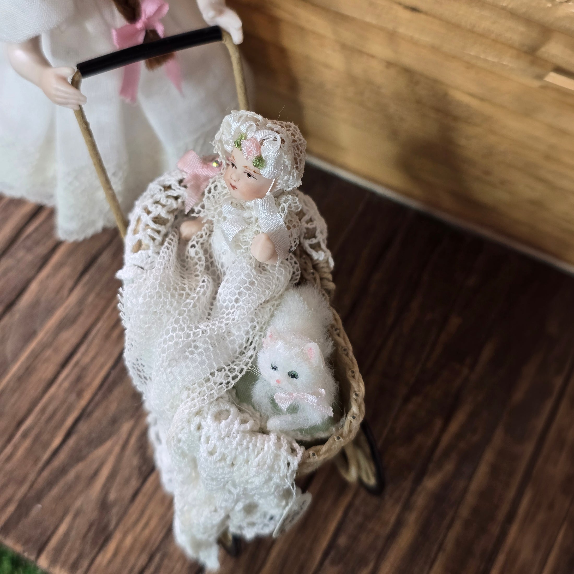 Signed Wicker Baby Pram with Porcelain Infant Doll and Cat by Bridget McCarty