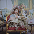 Load image into Gallery viewer, Seated Porcelain Little Girl Doll with Teacup, Pink Feathered Hat & Leather Shoes
