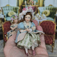 Load image into Gallery viewer, Seated Porcelain Little Girl Doll with Teacup, Pink Feathered Hat & Leather Shoes

