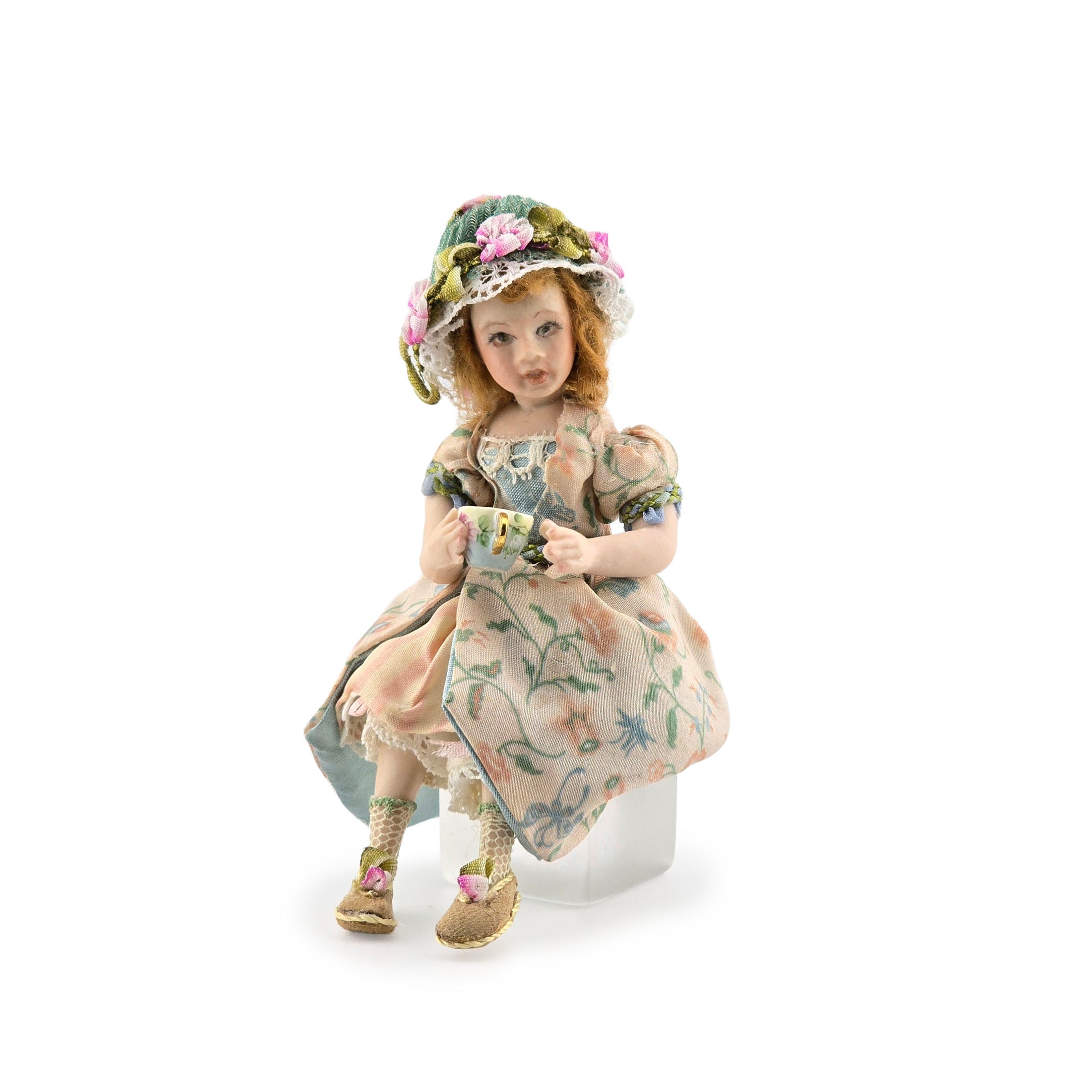 Seated Porcelain Little Girl Doll with Teacup, Green Silk Hat & Leather Shoes