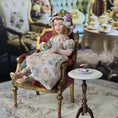 Load image into Gallery viewer, Seated Porcelain Little Girl Doll with Teacup, Green Silk Hat & Leather Shoes
