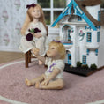 Load image into Gallery viewer, Seated Infant Baby Girl With Purple Ribbons OOAK Artisan Clay Miniature Doll
