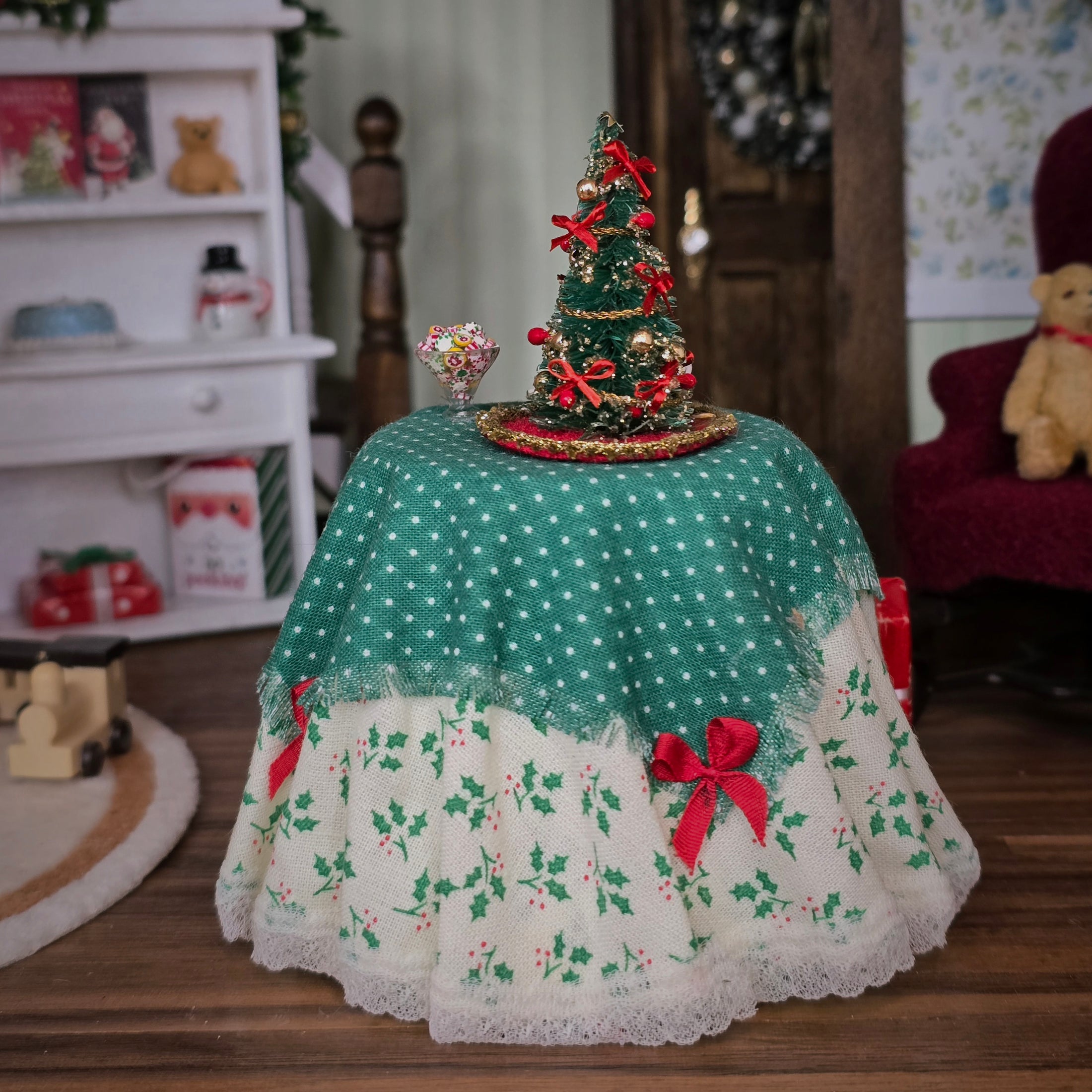 Decorative Christmas tree with a green polka dot skirt in a festive room setting.