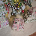 Load image into Gallery viewer, Decorative Christmas presents under a tree with ornaments.
