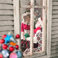 Load image into Gallery viewer, Vintage-style Mr. and Mrs. Claus miniature dolls, seen through a window
